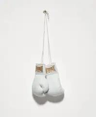 Gary Simmons, Everforward..., 1993, Pair of white leather boxing gloves with metallic gold thread and satin multiple