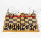 Charles Juhàsz-Alvardo, Duchamp in Check (Readymade Chess), 1995, The complete chess set comprised of a wooden chessboard with miniature reproductions of Marcel Duchamp's sculptures in wood, metal and glass and a set of plastic chess pieces