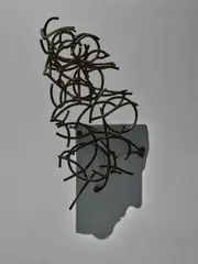 Larry Kagan, Duchamp Self-Portrait in Profile, 2015, Unique steel sculpture. When lit at the proper angle, a shadow is cast of Marcel Duchamp's face in profile