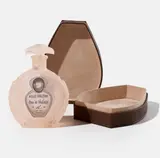 Annette Lemieux, Belle Haleine (Peach), 2015, Individually constructed surrogate cast resin perfume bottle with label redesign including the artist as Rrose Sélavy, contained in the original hand-constructed, cloth-lined leather box