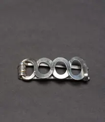 Barrette by Alexander Calder, 1954, silver wire, sold Feb 2025