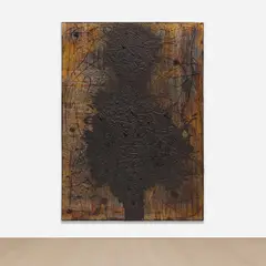 Rashid Johnson, Jones, 2013, burned red oak flooring, black soap, wax, vinyl, shea butter, book and space rock, in artist's frame
