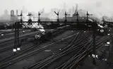 Hoboken Railroad Yards Looking Towards Manhattan, New Jersey by Berenice Abbott, 1935, Gelatin silver print, sold May 2023