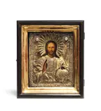 Christ Pantocrator, maker's mark in Cyrillic "SD" for Drozdov Sergey Dmitrievich, Moscow 1839, finely painted in strong colours in a repoussé, chased and engraved silver-gilt oklad with enamel captions; in glazed wooden kiot