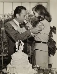 Ed Clark, Humphrey Bogart and Lauren Bacall at their Wedding, 1945, Ferrotyped gelatin silver print; signed in ink on the image, the photographer's Life Magazine credit stamp on the reverse