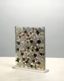 Arman, Untitled, 2004, watch faces embedded in resin in Plexiglas