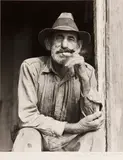 Marion Post Wolcott, A Spanish muskrat trapper in the doorway of his marsh home, Delacroix Island, St. Bernard Parish, Louisiana