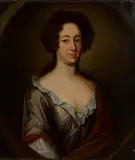 Sir Godfrey Kneller, A portrait of a lady, half-length, in a grey dress and brown mantle, oil on canvas, in a painted oval