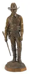 Texas Ranger by Douglas Van Howd, bronze with light brown patina on a wooden base, sold Jul 2013