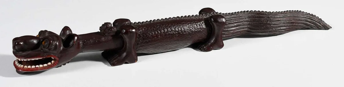Alligator-Like Beast by Ulysses Davis, carved and painted wood with applied beads, sold Jan 2025