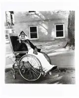 Diane Arbus, Masked Woman in Wheelchair, PA