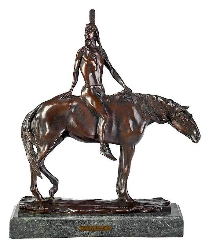 ˜The Warrior by Charles Humphriss, 1904, patinated bronze with green marble base, sold Feb 2020