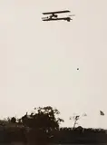 A silver gelatin print, of legendary aviator Lincoln Beachey. Titled "Boston Aviation Meet: Beachey in Flight" in, pencil