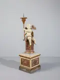 Scultore Del Xviii Secolo, Grande figura di angelo portacero su base in foggia di colonna su piedistallo quadrangolare, in legno laccato, parzialmente dorato e dipinto a imitazione del marmo, sculpture