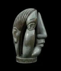 Terry Stringer, Diva Avid, The sculpture shows a female figure on one side (Diva), & on the reverse side a head in profile (Avid)
