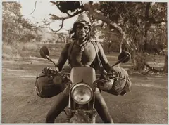David Gulpilil on Motorbike by Jon Lewis, 1992, Vintage Silver Gelatin Photograph, sold May 2021