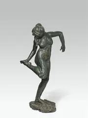 Edgar Degas, Dancer, looking at the sole of her foot, bronze