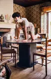 Erwin Wurm, Cahor Indoor Sculpture (woman like a dog on her table), 1999/2000, photograph, C-Print; framed; edition: 1/III