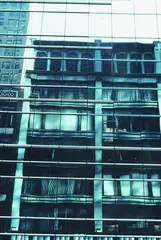 Wolff Buchholz, 3 Bll.: New York - Fassade mit Spiegelung. Manhattan - Spiegelung (5). Manhattan - Spiegelung (6), 1990, Colour photography