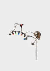Jean Tinguely, Ohne Titel, 1990, Welded sculpture with lamps: wall lamp made of iron, chain, feathers, candle holder and coloured bulbs
