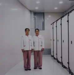 Selina Ou, Restroom Attendants - Changchun, China, 2003, chromogenic photograph