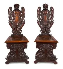 Robert Wilhelm Prenzel, , A PAIR OF BLACKWOOD CARVED HALL CHAIRS