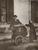 Eugène Atget, The Organ Grinder, Silver print mounted on card, circa 1960 by Berenice Abbott