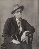 Berenice Abbott, James Joyce in Abbott’s Paris Studio, Gelatin silver print mounted on card likely a slightly later impression.