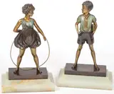 Johann Phillip Fedinand Priess, Hoop Girl and Sunny Boy, Bronze with gilt and verdigris patina and resting on onyx bases