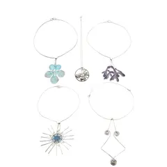 Norman Grant, GROUP OF FIVE PENDANT NECKLACES, 1970s, silver and enamel, indistinct maker's mark, hallmarked 1977, pendant 8cm diameter