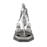 ART DECO FIGURAL LAMP, CIRCA 1925 by Pierre le Faguays, silvered bronze on a slate base, frosted glass shades, marked to the side FAYRAL, sold Apr 2024