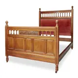 Bruce Talbert, AESTHETIC MOVEMENT WALNUT DOUBLE BED, CIRCA 1880, the footboard with corresponding gallery and panel carved in relief with sunflowers