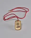 Rashid Johnson and Liz Swig, Anxious Men Gold Military Tag, 2020, 9 karat gold military tag with rhodium engraving, red enamel, ruby and red cord