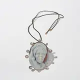 Spa Pendant by Cindy Sherman and Liz Swig, 2019, Oval-shaped carved sardonyx shell cameo with cultured pearls, 18 karat rose gold and dark gray cord, sold Apr 2025