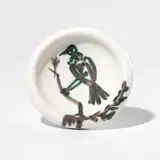 Oiseau sur la branche (Bird on a Branch) (A.R. 175) by Pablo Picasso, 1952, White earthenware round ashtray painted in black with partial brushed glaze; ceramic, Madoura edition, sold Apr 2025
