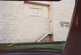 William Eggleston, Untitled (leasing sign on building)