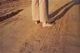 William Eggleston, Untitled (feet on earth road)