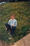 William Eggleston, Untitled (boy on grass)