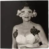 Diane Arbus, Lady at a Masked Ball with Two Roses in Her Dress, NYC, 1967, Gelatin silver print, printed later by Neil Selkirk