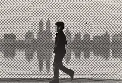 Ruth Orkin, Boy & Fence, Central Park Reservoir, 1954, Gelatin silver print, printed later