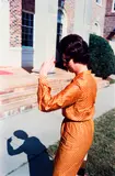 Untitled (woman in orange) by William Eggleston, circa 1970-1974, Dye transfer print, printed 2012, sold Mar 2025
