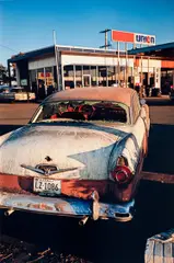 Untitled (rusting car) by William Eggleston, circa 1970-1974, Dye transfer print, printed 2012, sold Mar 2025