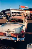 Untitled (rusting car) by William Eggleston, circa 1970-1974, Dye transfer print, printed 2012, sold Mar 2025