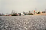 William Eggleston, Untitled (ground view from the street)