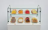 Claes Oldenburg, 24 Open-Faced Sandwiches, 1964, burlap soaked in plaster, tempera, porcelain plates, glass and metal case