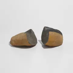 Isamu Noguchi, To Split and Carve, 1979, basalt, in 2 parts