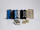 Arman, Invitation for 'Arman' at the Galerie Lawrence, Paris (in two parts); Equinoxes; and Full Up (Le Plein), 1960; 1965; and 1965-66, Two resin multiples with watch parts, nails and ball bearings, one screenprinted artist's book in colors, with text by André Verdet, folded (as issued), and one printed metal sardine can invitation