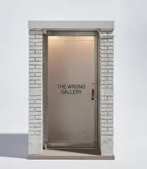 Maurizio Cattelan, The 1:6 Scale Wrong Gallery, 2006, Multiple comprising wood, brass, steel, aluminum, resin, plastic, glass and electric lighting, with accompanying copy of the Wrong Gallery Times, all contained in the original cardboard box