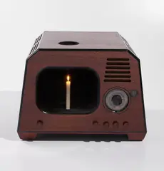 Before the Word there was Light, after the Word there will be Light by Nam June Paik, 1992, 1948 DuMont television casing containing a candle, sold Oct 2024