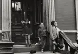 Helen Levitt, N.Y.C. (masked children on stoop)